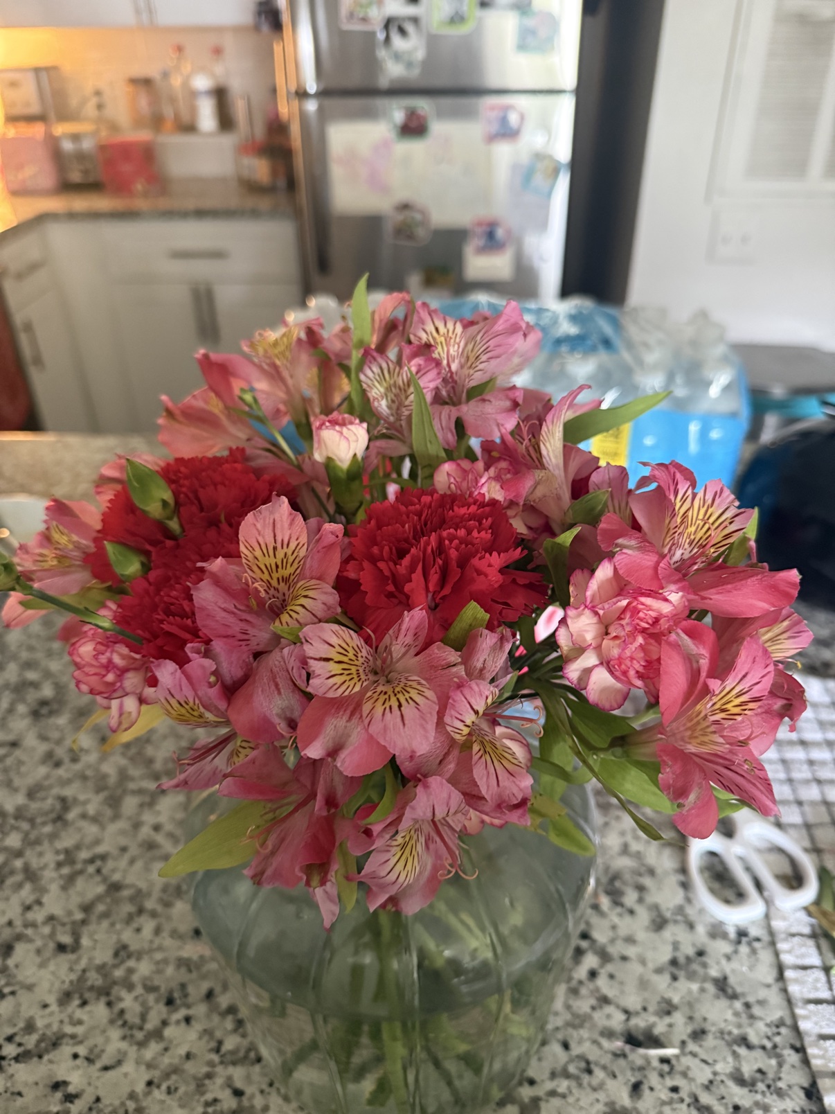 Pink flowers arranged in a glass vase